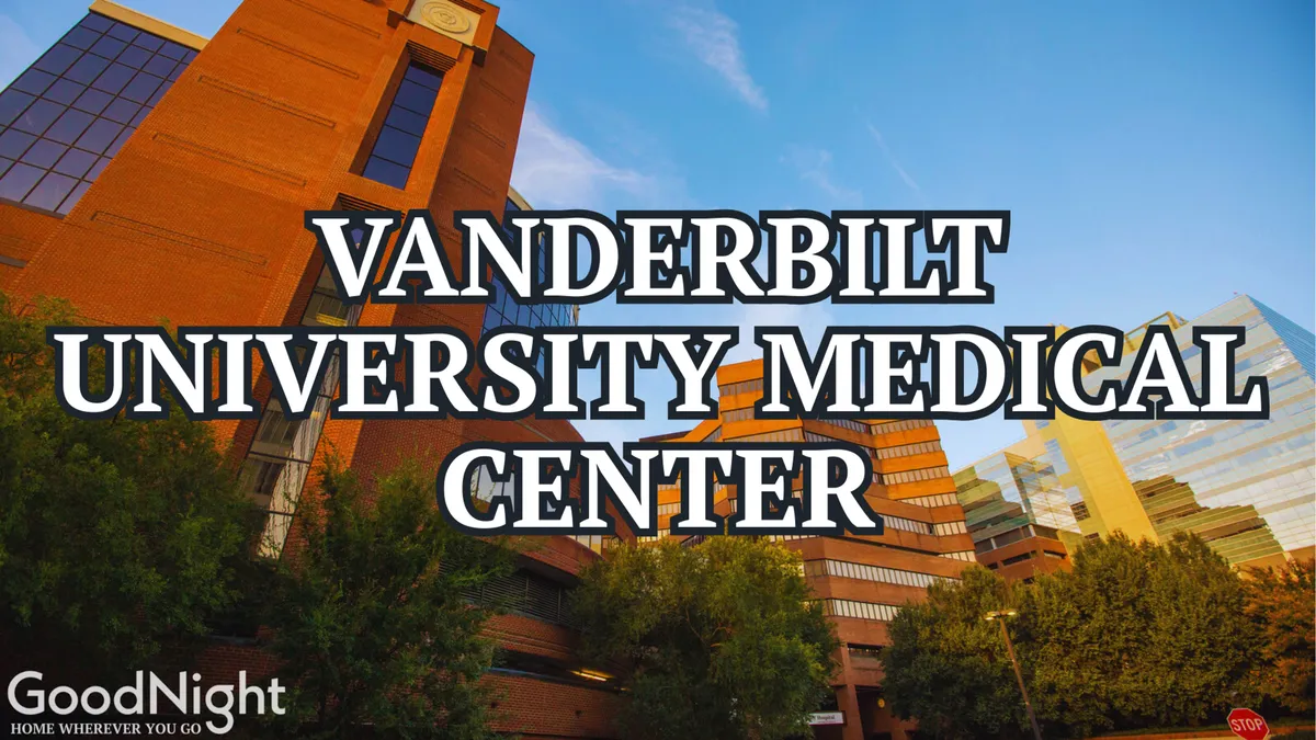 A modern medical center with a prominent Vanderbilt University Medical Center building, surrounded by greenery and framed against a clear sky, signaling accessibility and a professional, welcoming atmosphere.